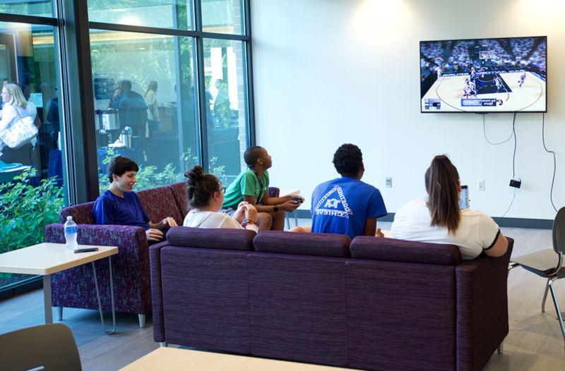 students watching TV in the lounge